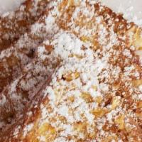 Crunchy French Toast · 2 thick slices of Texas toast coated with frosted flakes, cinnamon and powdered sugar.