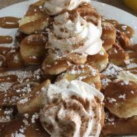 Peanut Butter And Banana French Toast · 2 thick slices of Texas toast coated with cinnamon, powdered sugar topped with bananas and h...