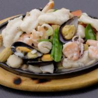 Seafood Combination · Lobster meat, shrimp, crab meat, and scallop with vegetable in tasty white sauce with rice.