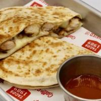 Quesadilla · Cheese and choice of eggs with meat. Served with hash brown.