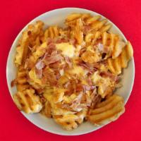 Loaded Waffle Fries · Our signature Waffle Fries covered in melted cheese and crispy bacon! 487 cal.