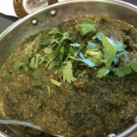 Saag Paneer · (Spinach and Indian cheese). Spinach cooked with tender cubes of Indian cheese, herbs, and o...