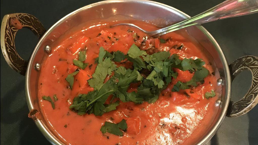 Paneer Tikka Masala · (A gourmet dish). Marinated paneer with tomato and yogurt-based gravy.