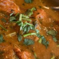 Chicken Tikka Masala · Tender boneless pieces of marinated chicken cooked in creamy sauce with fresh tomatoes and o...
