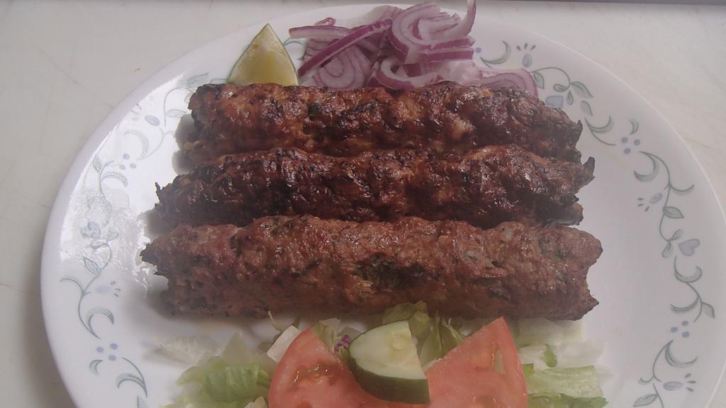 Chicken Seekh Kebab · (3 pieces in one order). Ground chicken mixed with Indian spices and grilled on skewers.