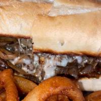 Philly Cheese Steak · Tender chopped chicken or beef topped with sautéed mushrooms and onions, sweet peppers, and ...