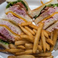 Traditional Club · Sweet honey ham, smoked turkey breast, crisp bacon, swiss and cheddar cheeses layered betwee...