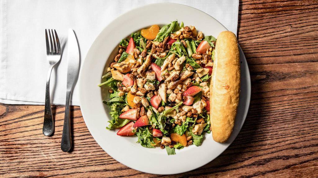 Berry Pecan Chicken Salad · A delightful mixture of fresh strawberries, mandarin oranges, candied pecans and grilled chicken served on a bed of mixed greens. Served with raspberry vinaigrette dressing.