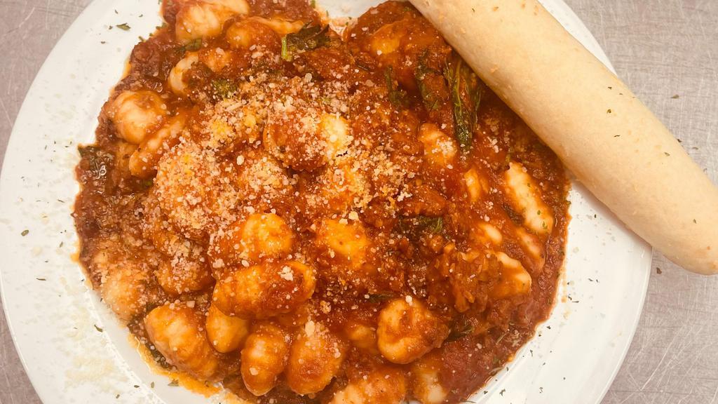 Gnocchi · Potato Gnocchi's in fresh garlic basil and tomato sauce covered in fresh parmesan cheese