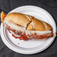 Chicken Parmesan  · A delicious  breaded chicken breast topped with marinara sauce and mozzarella cheese baked i...