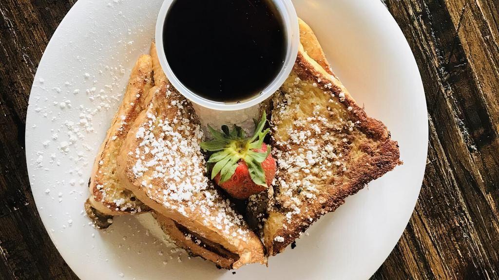 French Toast · Dusted with powdered sugar and served with hot maple syrup.