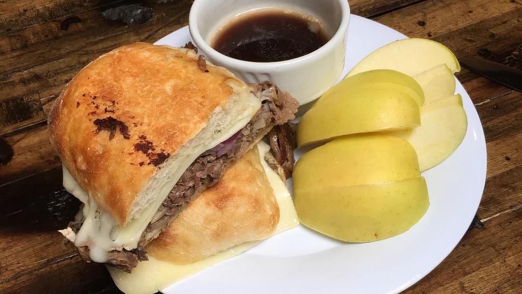 French Dip · Served with sliced usda prime ribeye loin, grilled onions, swiss cheese, and a horseradish dill mayo on a ciabatta bun. Served with house made au jus.