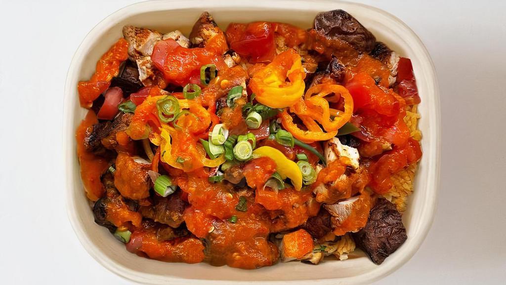 Spicy Jollof Chicken Bowl · Free range chicken thigh, spicy jollof rice, sauteed peppers x onions, Appharvest tomato, pickled peppers and green onion with In Season hot sauce
