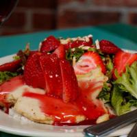 Raspberry Chicken Salad · sautéed chicken breast served over couscous, with baby green salad, topped with strawberrie...