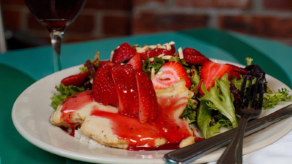 Raspberry Chicken Salad · sautéed chicken breast served over couscous, with baby green salad, topped with strawberries, almonds, and raspberry dressing