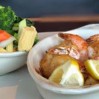New England Style Stuffed Shrimp · Stuffed with crabmeat, a choice of a salad and a side item.
