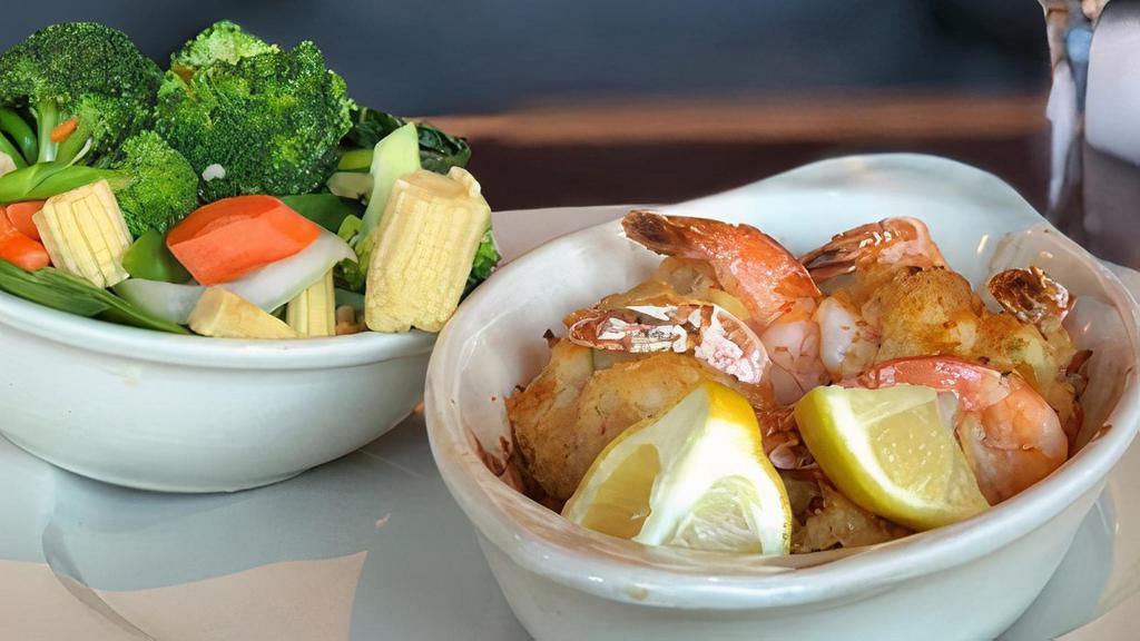 New England Style Stuffed Shrimp · Stuffed with crabmeat, a choice of a salad and a side item.