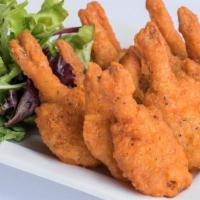 Butterfly Shrimp · Light hand breaded butterfly shrimp fried golden brown and served with our spicy.