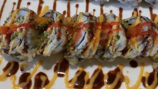 Volcano Roll · Six pieces. Fried roll. Raw. Tuna, salmon, yellowtail and avocado, lightly fried, with mixed spicy dressing.