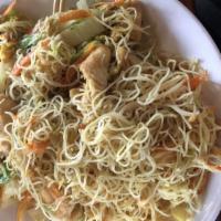 Singapore Rice Noodles · Wok-fried shrimp, chicken, egg, scallion and shredded carrots with thin rice noodles in yell...