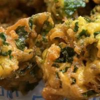 Kale Pakoras · Indian style savory kale fritters made with curried chickpea batter. Served with green chutn...