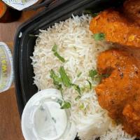 Butter Chicken & Rice · Boneless chicken in an over the top tomato cream-butter sauce with jaggery, roasted garam ma...