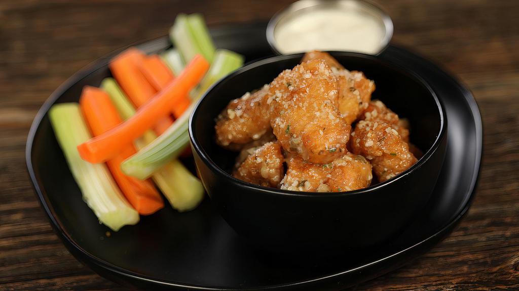 Boneless Garlic Parmesan · 8 boneless wings tossed in garlic parmesan (mild heat), served with carrots & celery and a dipping sauce of your choice.