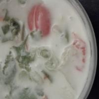 Tom Kha · Thai coconut cream soup with galangal and lemongrass, lemon leaf, tomato, straw mushroom. Yo...