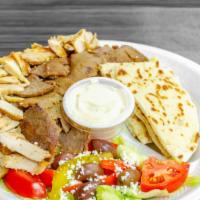 Mix Shawarma Plate · Sliced chicken and gyro shawarma served on top of rice, with your choice of lettuce, tomatoe...