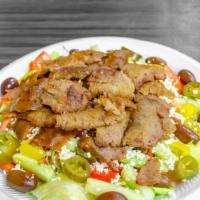 Gyro Salad · Beef and lamb served with your choice of fresh lettuce, tomatoes, onions, cucumbers or tabbo...