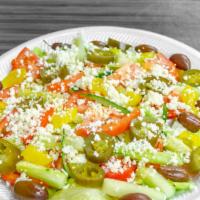 Greek Salad · Fresh lettuce, tomatoes, onions, cucumbers, feta cheese, black olives and style sauce.