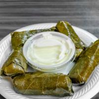 Grape Leaves · Five pieces grape leaves stuffed with rice, herbs and spices.