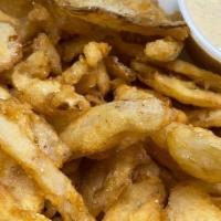 Onion Strips · Our in house, thinly sliced onion strips, lightly battered and fried to golden brown. Served...