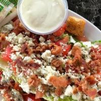 Lettuce Wedge · Lettuce Wedge, either iceberg or romaine with diced tomatoes, bacon and croutons with your c...