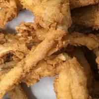 Frog Leg Dinner W/ 2 Hushpuppies · Fresh, farm raised frog legs,  lightly breaded and fried. Served with 2 of our house made hu...