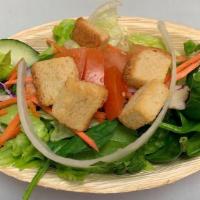 Side Salad · Iceberg lettuce, spinach and romaine blend with diced onions, shredded carrots, purple cabba...