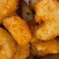 Popcorn Shrimp · Breaded and fried popcorn size shrimp, served with your choice of sauce.