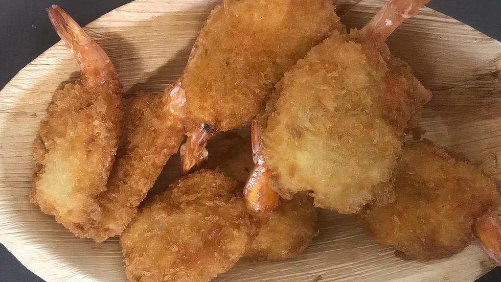 Butterfly Shrimp · Butterflied shrimp hand breaded in our own breading, served with you choice of sauce.