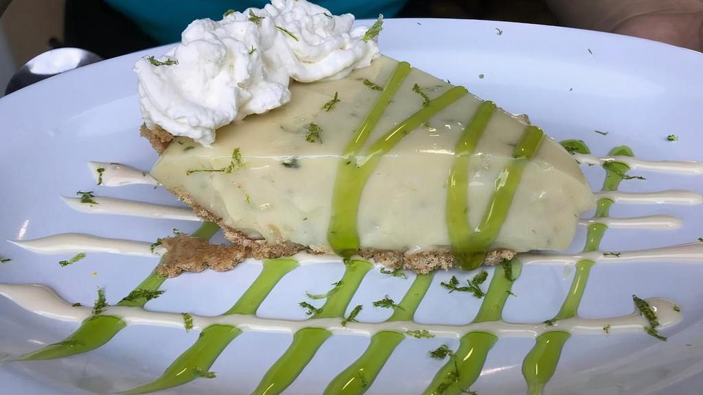 Key Lime Pie · Our very own house made Key Lime pie; made with real key lime juice topped with our freshly made whipped cream, Kiwi Lime sauce, lime twist.