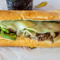 Philly Cheesesteak · Thinly sliced sirloin steak, caramelized onions, sautéed bell peppers, and melted provolone ...