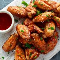 Applewood Smoked Party Wings · 10 applewood smoked and flash fried party wings. Served tossed in your choice of BBQ, buffal...