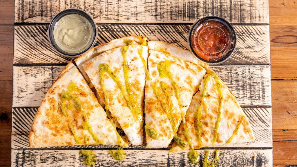 Bacon Ranch Chicken Quesadilla · Grilled chicken breast, honey glazed pepper bacon, and three-cheese blend of cheddar, pepper jack, and parmesan. House-made ranch dressing served with sour cream and salsa on the side.