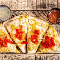 Spicy Southwest Quesadilla · Marinated grilled chicken, our black bean corn salsa, cilantro, three cheese blend of chedda...