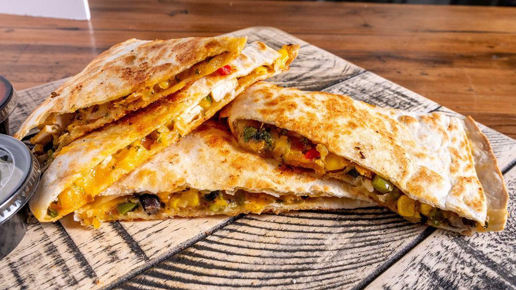 Beef & Chorizo Quesadilla · The perfect blend of beef & chorizo inside a crispy tortilla shell, filled with a 3 cheese blend and warm cheese dip.