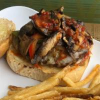 Mushroom & Swiss Extravaganza Burger · Sauteed peppers, onions and mushrooms, red pepper relish, chipolte ketchup, mayo and Swiss c...