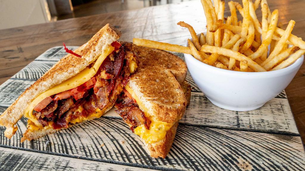 Grown Up Grilled Cheese · Jalapeño pimento cheese, swiss and cheddar cheese, grilled tomatoes, and honey glazed pepper bacon on wheat. Comes with a pickle spear and your choice of a side.