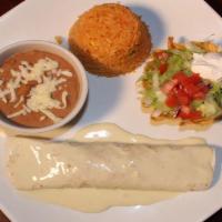 Burrito Carne Asada · A flour tortilla filled with marinated steak strips, rice, and beans. Covered with nacho che...