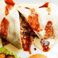 Burrito Campechano · A big flour tortilla filled with marinated chicken strips and chorizo(Mexican Sauce) topped ...