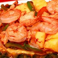 Fajita Piña · This phenomenal fajita comes to your table in a fresh pineapple half scooped out and filled ...