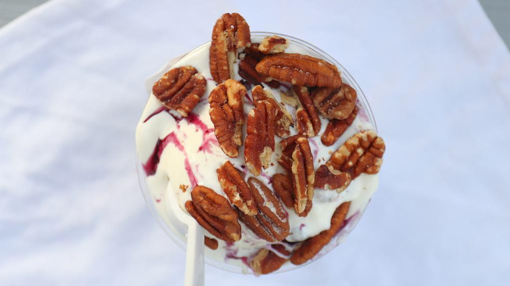 Blueberry Hill Sundae · Blueberry topping and creamy marshmallow topped with gourmet salted roasted pecans.